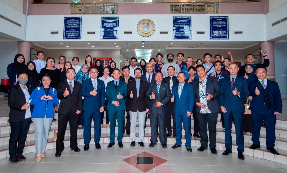 University Malaysia Sabah Labuan International School (UMSKAL) Faculty of International Finance Labuan (FKAL) Dean Assoc Prof Dr Geoffrey Harvey Tanakinjal (front, forth right) with Neurogine Sdn Bhd Chairman Chen Chee Peng (front, fifth left) and Labuan Chamber of Commerce (LCC) Chairman Daniel Doughty (front, second right) at the Letter Collaboration Signing Ceremony between parties at UMSKAL today. - BERNAMAPIX