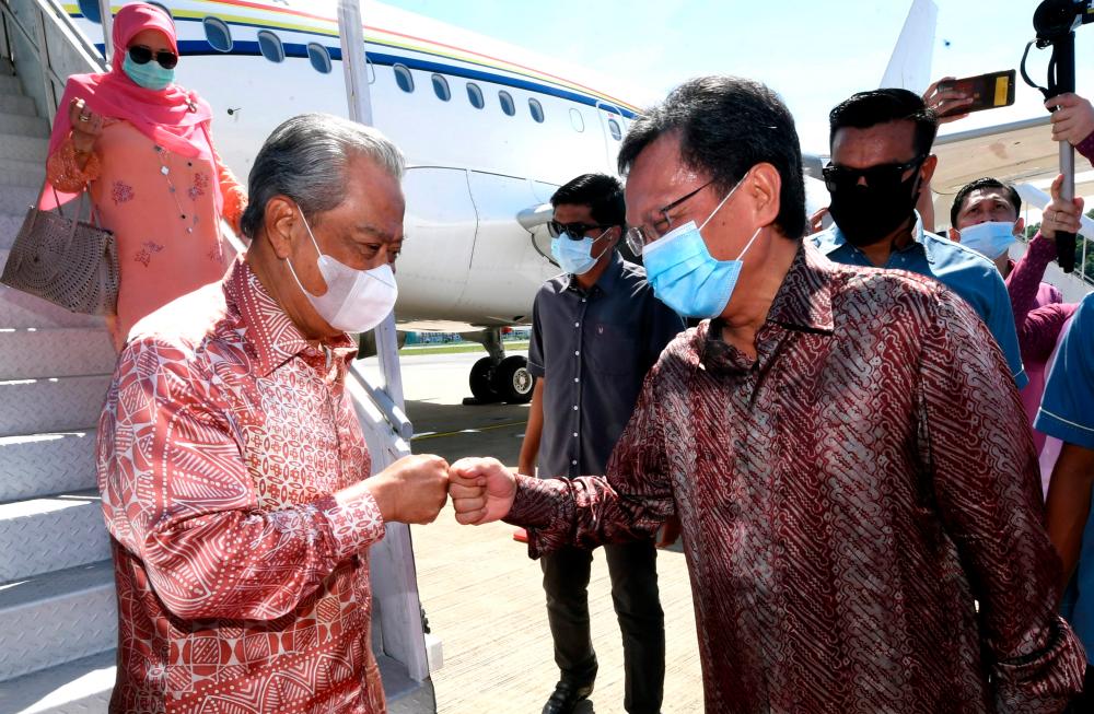 Prime Minister Tan Sri Muhyiddin Yassin was welcomed by Sabah Chief Minister Datuk Seri Mohd Shafie Apdal upon arrival at Kota Kinabalu International Airport for two-day working visit starting today. — Bernama