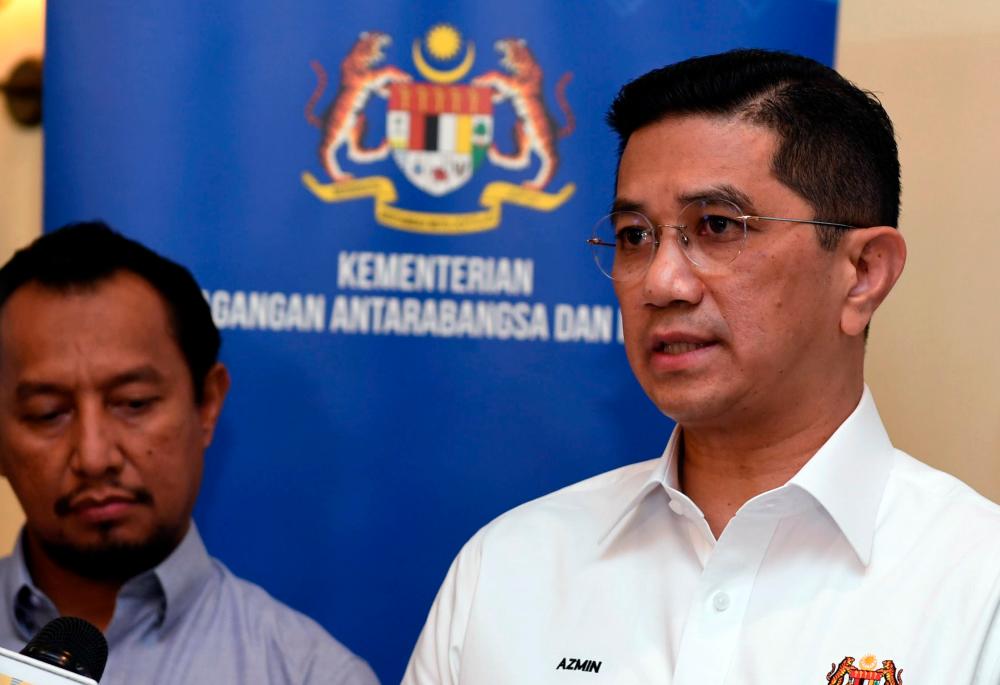 Senior Minister cum International Trade and Industry Minister Datuk Seri Mohamed Azmin Ali talks to reporters after his meeting with Bumiputera entrepreneurs in conjunction with his working visit to Sabah today. — Bernama