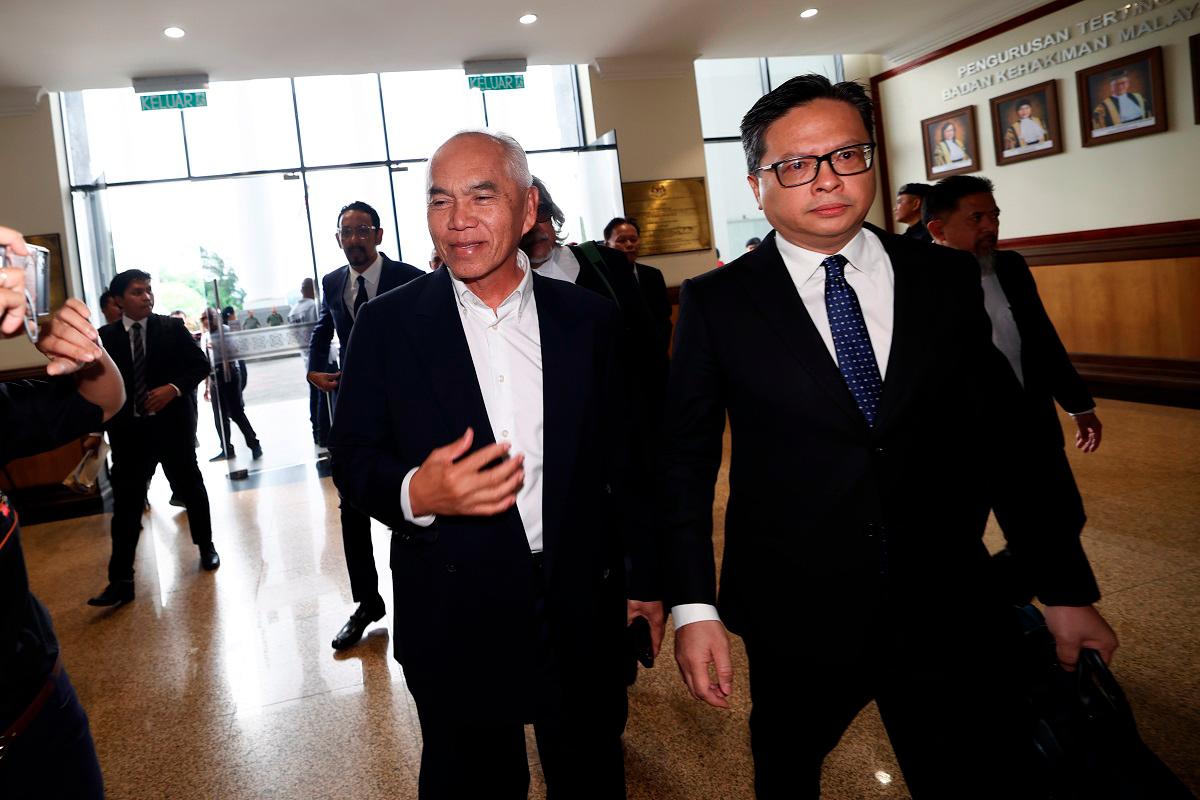 Sindumin assemblyman Datuk Dr Yusof Yacob (left) arriving at the Kota Kinabalu court complex to face his charge. - Bernama pic