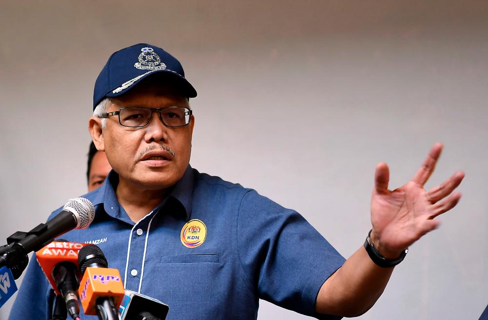 Home Minister Datuk Seri Hamzah Zainudin at a press conference after visiting the Kota Kinabalu Temporary Detention Centre today. - Bernama