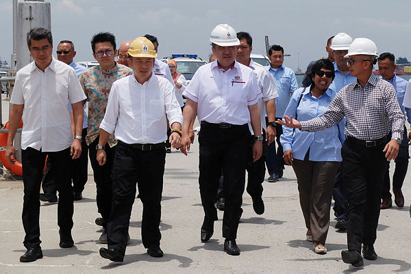 Transport Minister Anthony Loke Siew Fook (three, right) at the Labuan Port today. — Bernama