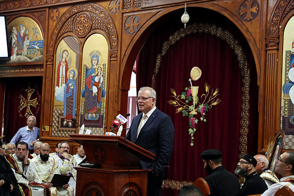 This handout from the Australian Prime Minister’s Office taken and released on March 17, 2019 shows Prime Minister Scott Morrison at the St Mark Coptic Church in Arncliffe — AFP
