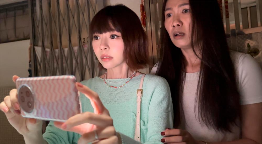 $!Minchen (left) delivers a commendable performance as Lily, the YouTuber drawn into the ghostly drama.