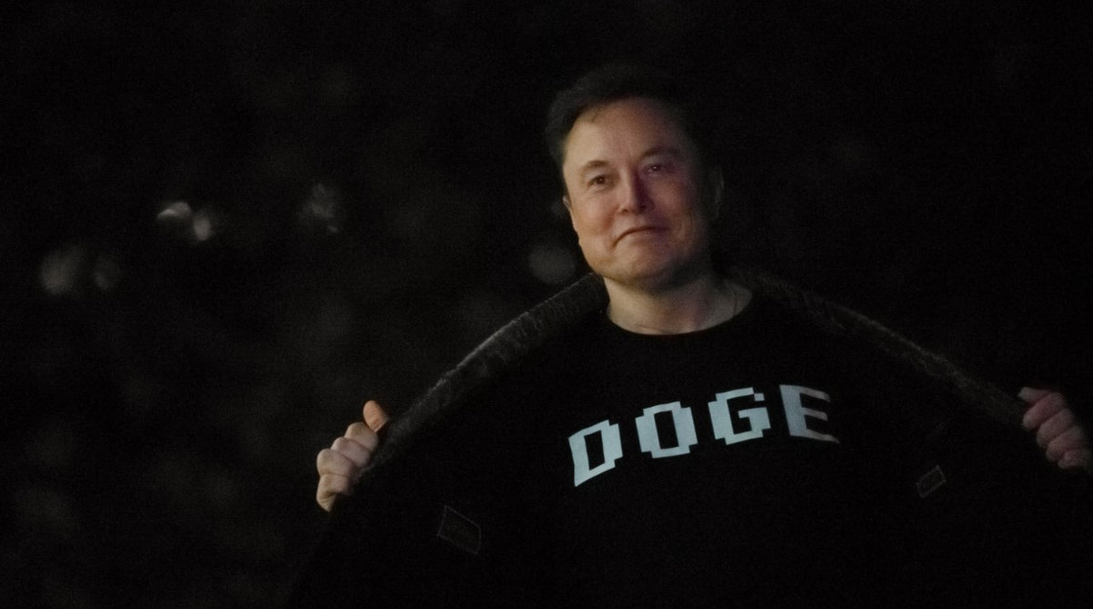 Senior Advisor to the President of the United States Elon Musk shows his shirt to the press as he arrives with U.S. President Donald Trump on the South Lawn of the White House in Washington, D.C., U.S., March 9, 2025. - REUTERSpix