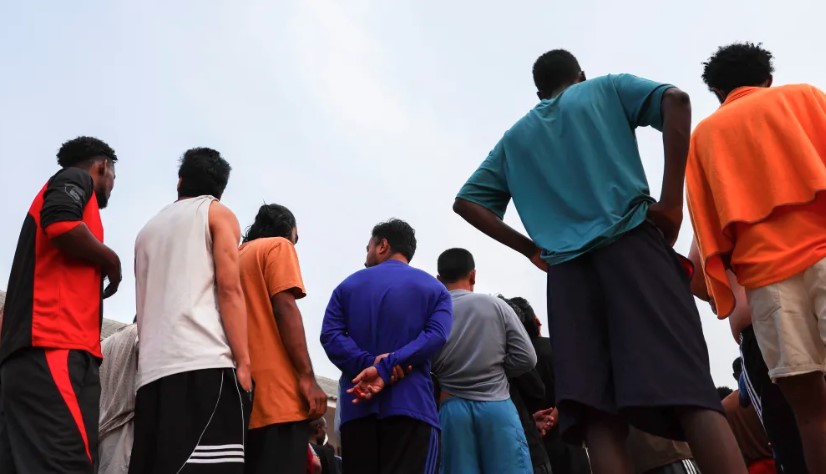 Multinational victims of scam centres queue to get food at a shelter as they wait for their embassies to pick them up, in Tak province, Thailand February 19, 2025. - REUTERSpix