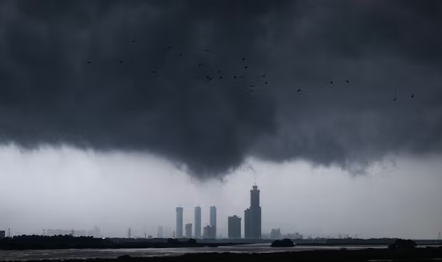 Monsoon clouds loom over the overflowing river Yamuna, in New Delhi, India, July 15, 2023. - REUTERSpix