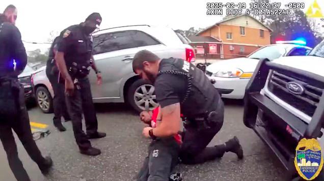 A police officer searches William McNeil Jr, 22, who is pinned on the ground after he was pulled over during a traffic stop, at an unidentified location, in Florida, U.S. February 19, 2025, in this screenshot obtained from a handout video. - Jacksonville Sheriff’s Office/Handout via REUTERSPIX