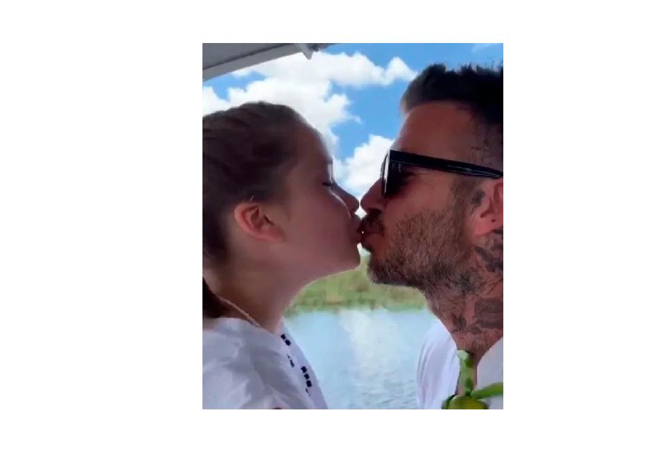 Screenshot of Becks kissing his daughter.