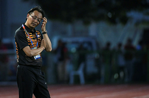 Datuk Ong Kim Swee reacts after Malaysia’s loses 3 – 1 to Cambodia at the Rizal Memorial Stadium in Manila yesterday.