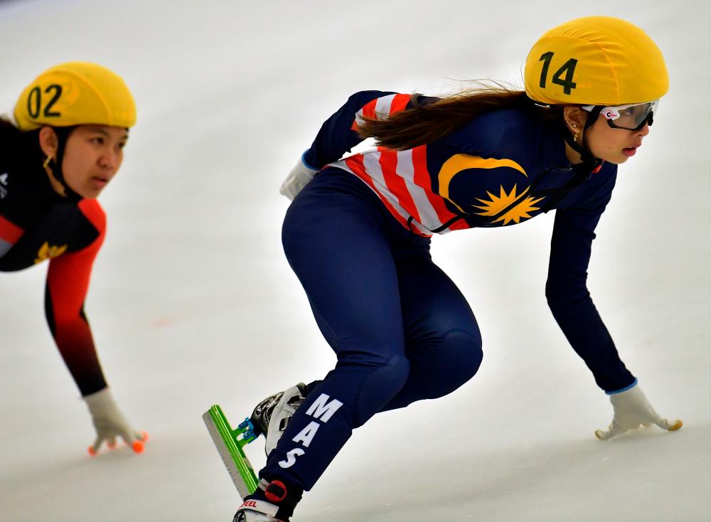 National ice skater Dione Tan Shu Yen competes in the women’s 1,000m short track speed event at the SM Megamall Ice Skating Rink in Manila today. - Bernama