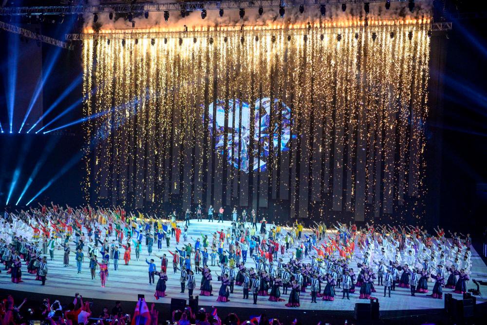 Performers take part as a digital fireworks fountain is shown during the opening ceremony of the SEA Games at the Philippine Arena in Bocaue, Bulacan province, north of Manila on November 30, 2019. - AFP