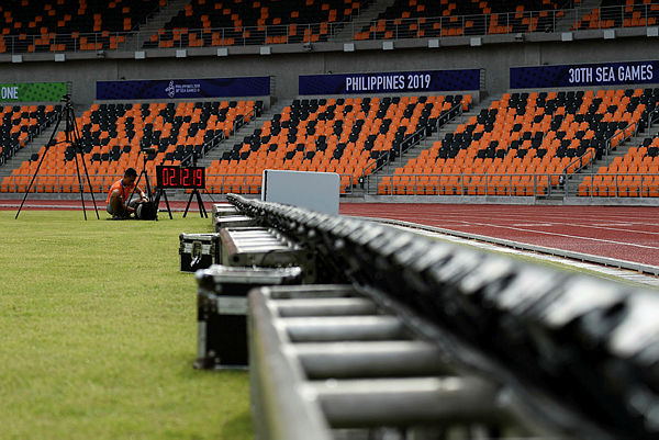 An operator works on a timing system inside the athletics stadium in New Clark City, in Capas town, Tarlac province north of Manila on Dec 2, 2019 — AFP