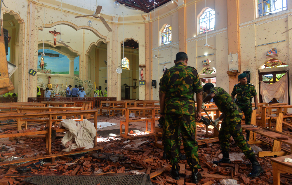 Security personnel inspect the interior of St Sebastian’s Church in Negombo April 22, 2019, a day after the church was hit in series of bomb blasts targeting churches and luxury hotels in Sri Lanka. — AFP