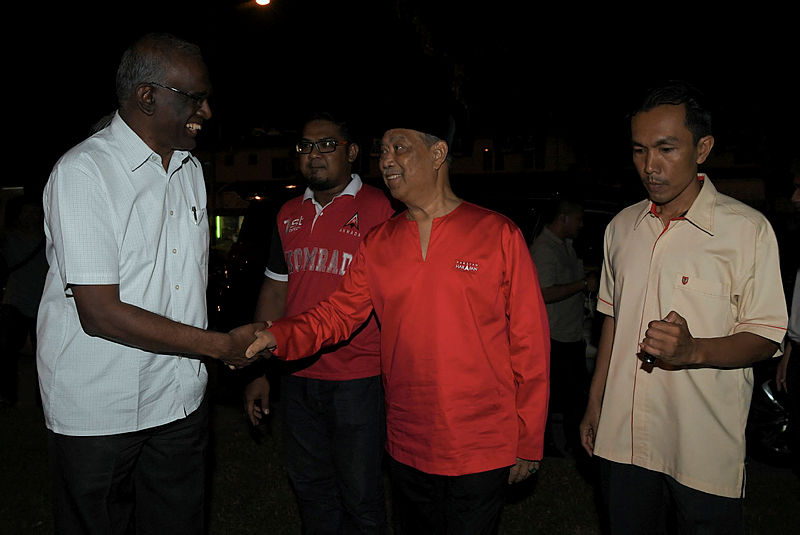 Bersatu President Tan Sri Muhyiddin Yassin (C) greets a guest at a rally in conjunction with the Semenyih by-election at Batu 26, Beranang, on Feb 21, 2019. — Bernama