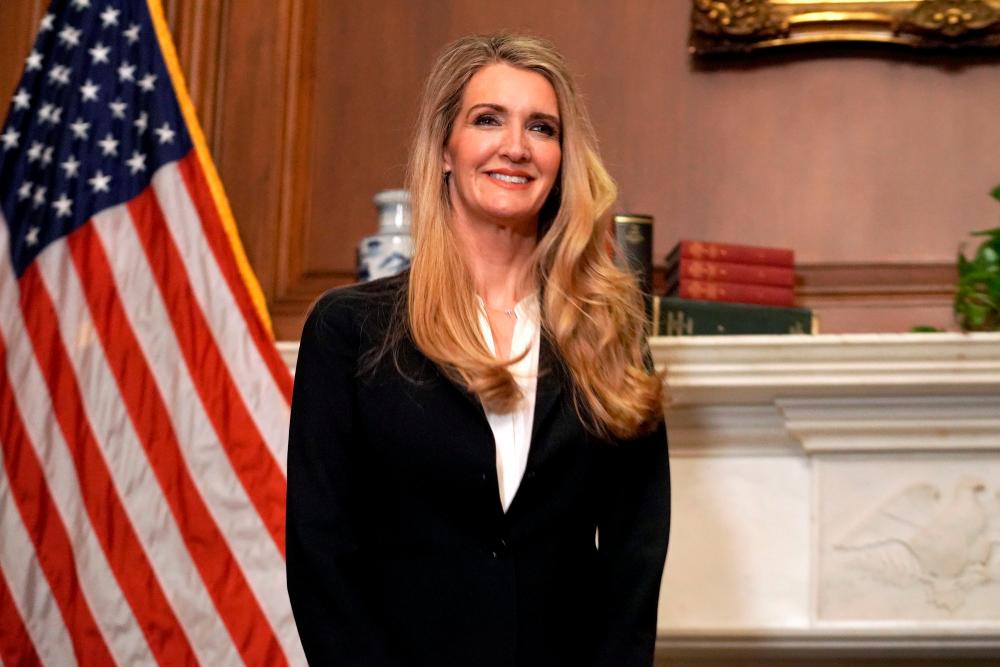 In this file photo taken on September 30, 2020 Republican Senator from Georgia Kelly Loeffler smiles as she meets with US Supreme Court nominee Amy Coney Barrett (off frame) at the US Capitol in Washington, DC. — AFP