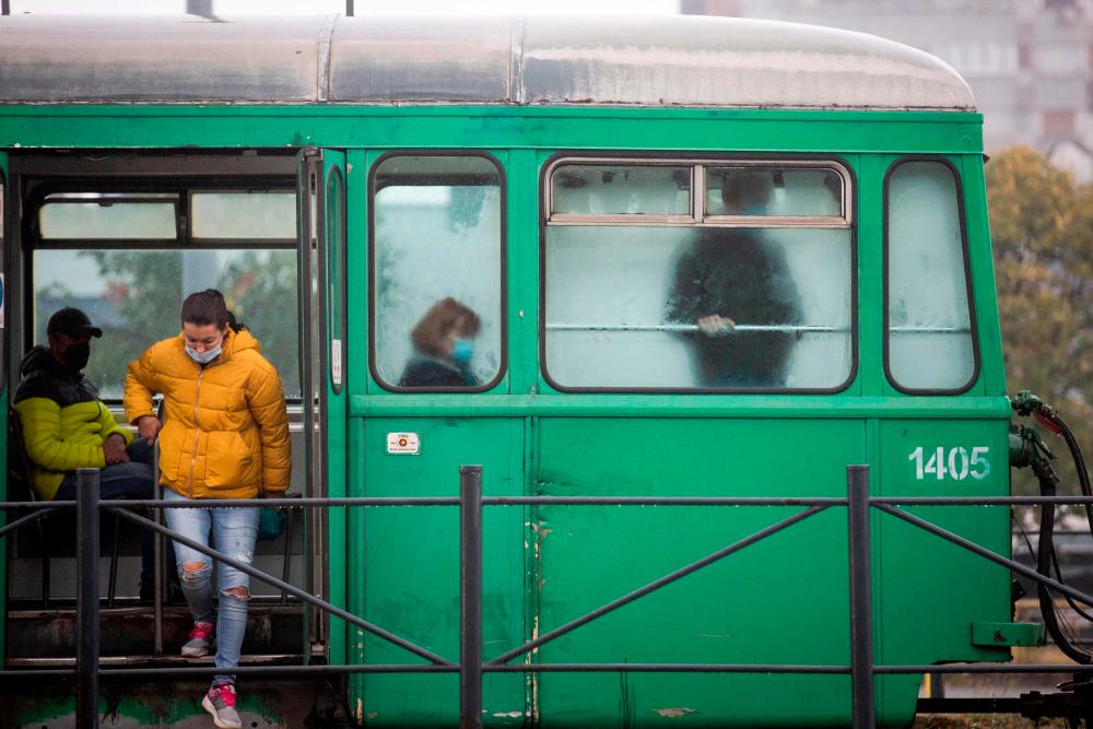 Passengers wearing face masks ride a tram in Belgrade on October 11, 2021, amid the Covid-19 (novel coronavirus) pandemic. AFPpix