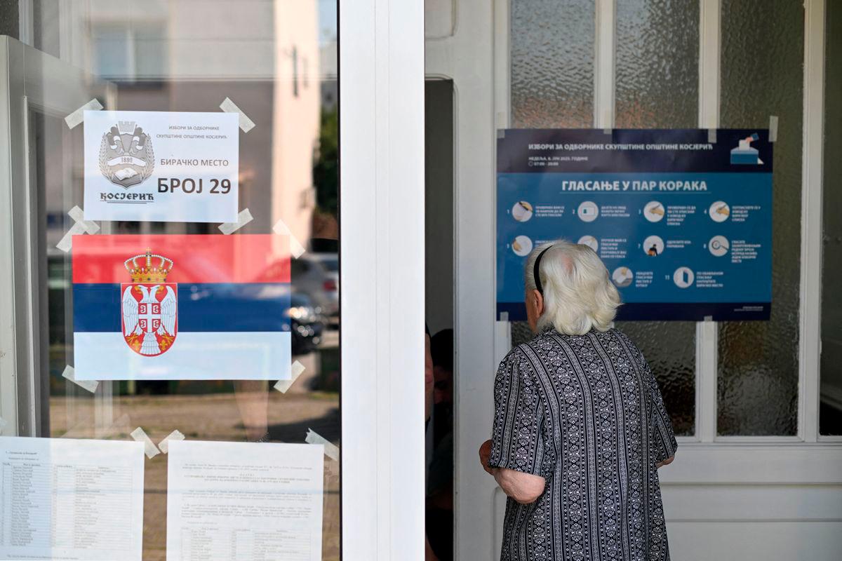 A woman enters at a polling station during the local elections in Kosjeric town, Serbia,in Kosjeric, a town of 10,000 in western Serbia, on June 8, 2025. AFPpix