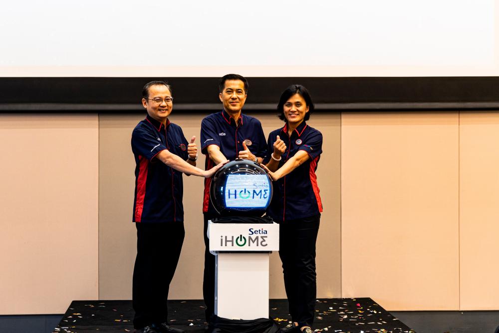 From left: S P Setia divisional general manager Koh Sooi Meng; Tan, and deputy general manager Lee Mei Foong