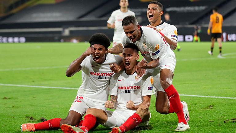 Sevilla’s Lucas Ocampos (bottom right) celebrates scoring their first goal with teammates during the Europa League quarterfinal match against Wolverhampton Wanderers at the MSV-Arena in Duisburg, Germany. – REUTERSPIX