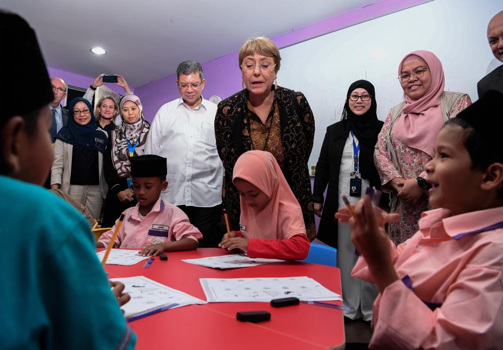 Foreign Affairs Minister Datuk Saifuddin Abdullah (4th from R) joins UN High Commissioner for Human Rights Michelle Bachelet (3rd from R) visiting Rohingya children at the Rohingya Integrated School of Excellence (RISE) today.- Bernama