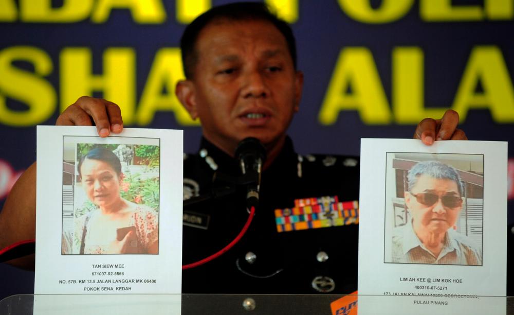 Filepix of Shah Alam police chief ACP Baharudin Mat Taib with photos of the victims, during a press conference on Aug 29, 2019. — Bernama