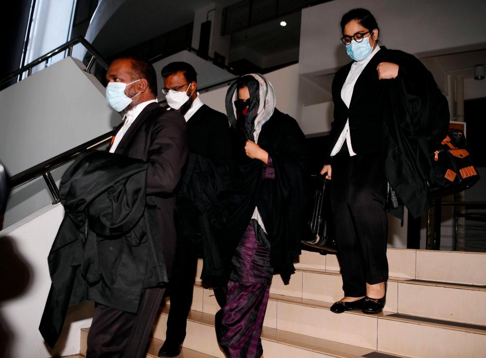 SHAH ALAM, June 21 - Samirah Muzaffar (second, right), widow of Cradle Fund Sdn Bhd chief executive officer Nazrin Hassan, walked out of the Shah Alam High Court today, after judge Datuk Ab Karim Ab Rahman released and acquitted her along with two teenagers. charges of killing Nazrin. BERNAMAPIX