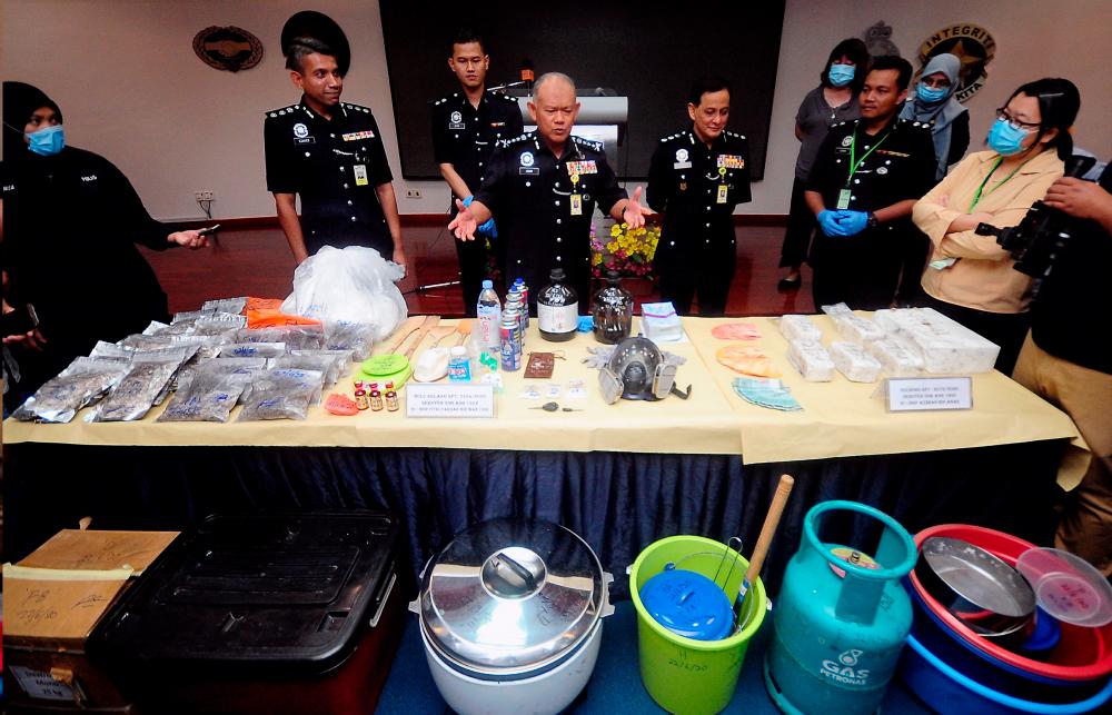 Selangor police chief Commissioner Datuk Noor Azam Jamaludin shows drugs and other items seized, during a press conference on June 24, 2020. — Bernama