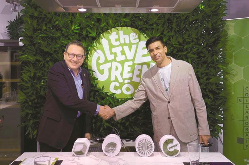 Leonard Ariff (left) and The Live Green Co chairman Nagarajan Pillay at the collaboration signing ceremony.