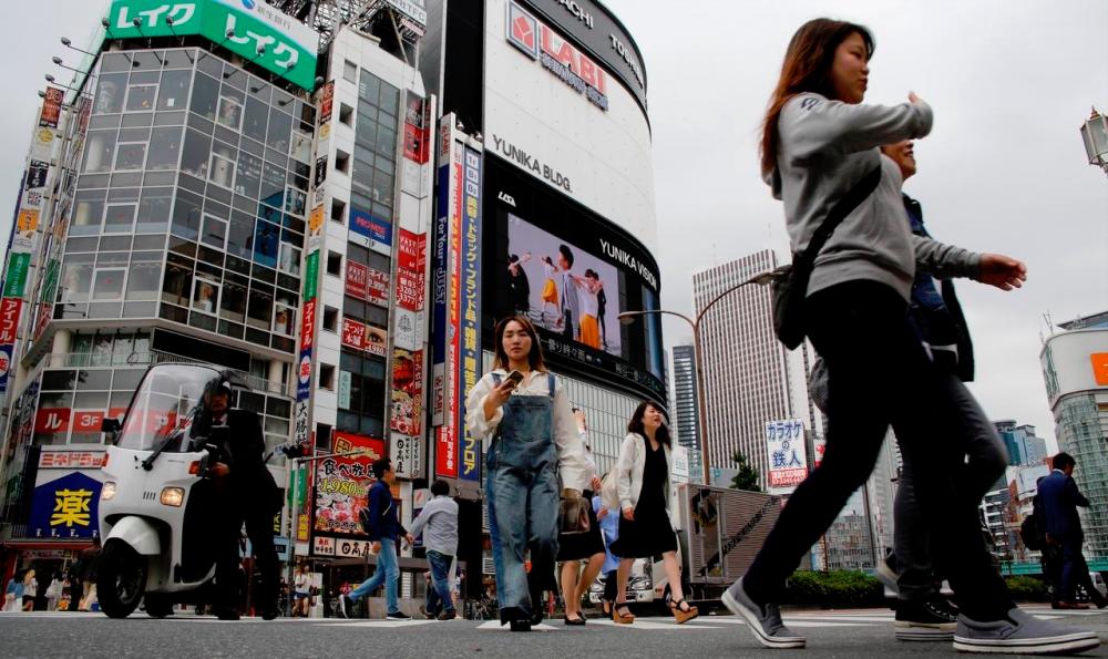 A view of the Shinjuku shopping and business district in Tokyo. The Cabinet Office report says the Japanese economy is expected to continue recovering moderately thanks to government stimulus measures. – REUTERSPIX