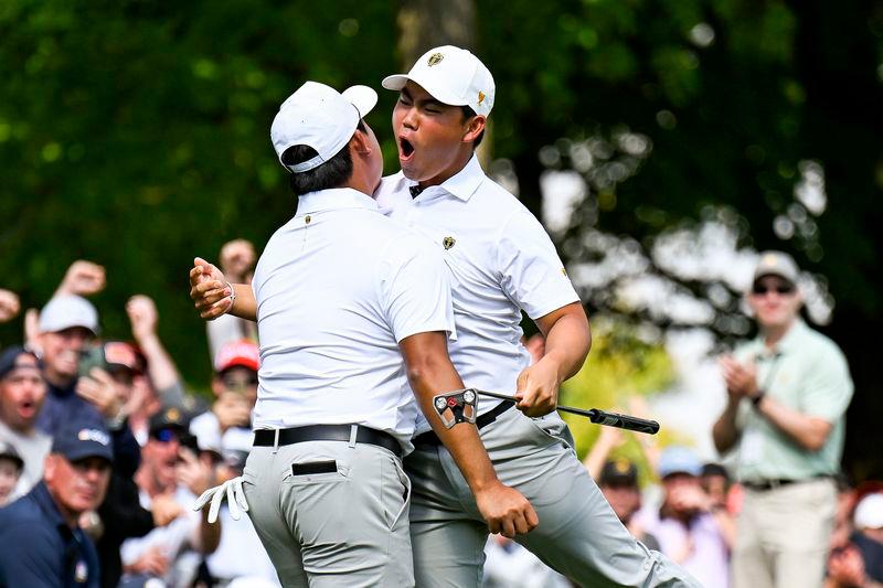 Si Woo Kim (left) and Tom Kim celebrating during the Four-ball session at the Presidents Cup on Saturday. Credit Getty Images