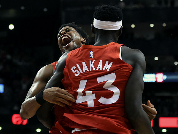 Toronto Raptors forward Pascal Siakam (43) is greeted by guard Kyle Lowry (7) after scoring at the buzzer to beat the Phoenix Suns at Scotiabank Arena. — AFP