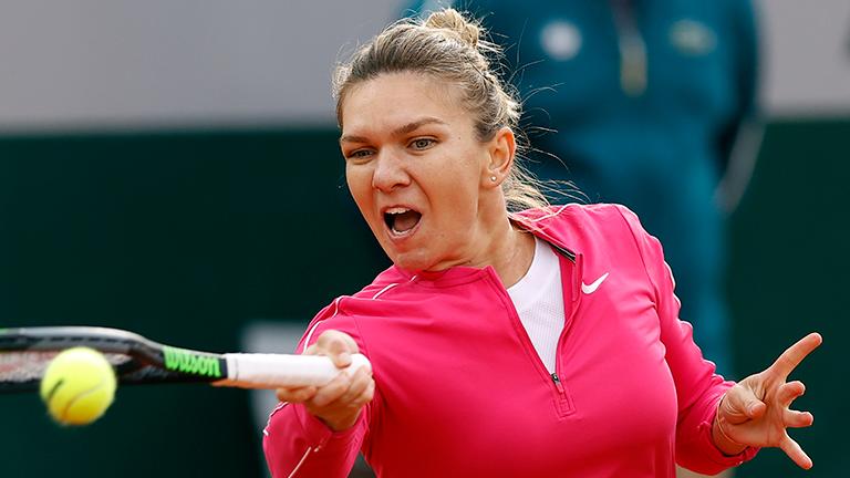 Happy Halep rediscovers touch to stay in Open