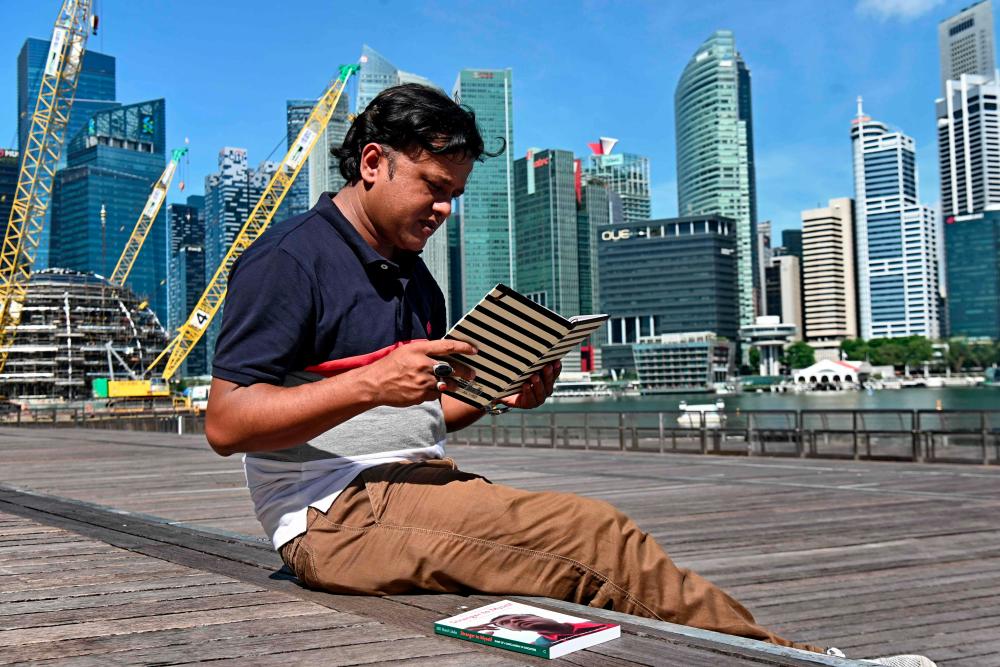 This photograph taken on April 15, 2019 shows Bangladeshi migrant worker M .D. Sharif Uddin posing for a photograph in Singapore. — AFP