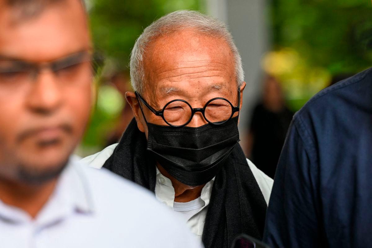 Malaysian hotel tycoon Ong Beng Seng (C) leaves the State Court in Singapore - AFP