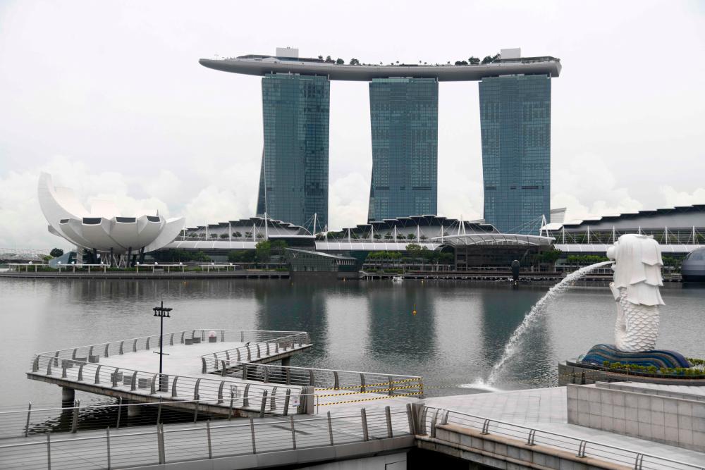 The Merlion Park jetty is seen cordoned off with tape to prevent people from gathering as a measure against the spread of the COVID-19 novel coronavirus in Singapore on May 27, 2020. - AFP