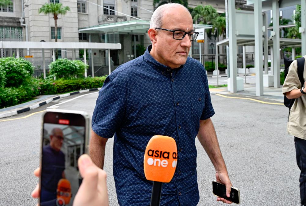 Singapore’s former Minister for Transport and Minister-in-charge for Trade Relations, S. Iswaran, arrives at the State Court for the start of his 12-month jail sentence - AFPpix