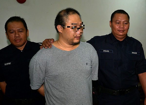 The 35-year-old suspect in the Cambodia scam case, during the remand process. Picture taken on Feb 28, 2019. — Bernama