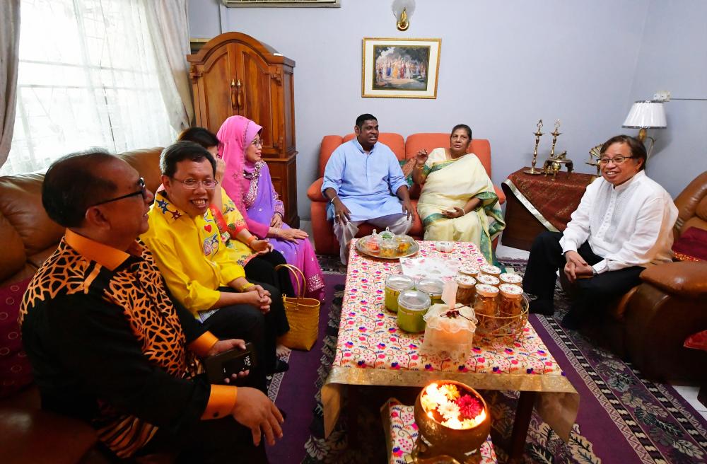 Sarawak Chief Minister Datuk Patinggi Abang Johari Tun Openg (R) attends a Deepavali celebration. - Bernama