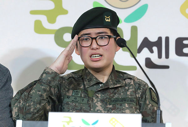South Korean Army staff sergeant Byun Hee-soo, who voluntarily enlisted before having gender-reassignment surgery in November, reacts as she expresses her desire to remain in the army during a press conference at the Military Human Rights Center for Korea in Seoul on Jan 22. — AFP