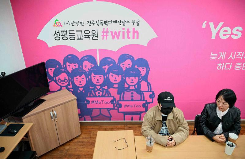 On Ji-goo (L), who wanted to use her pen name and declined to reveal her face for security reasons, and Jung Yun-jung (R), an activist who supported On throughout her trials, attending an interview with AFP at a support centre for victims of sexual violence in Jinju - AFPpix