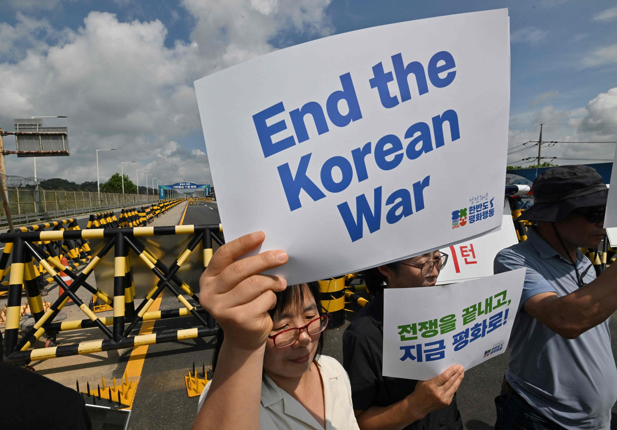Anti-war activists hold a rally to mark the 70th anniversary of the signing of the Korean War Armistice Agreement, near a military check point on the Tongil bridge, the road leading to the truce village of Panmunjom, in the border city of Paju on July 27, 2023. - AFPpix
