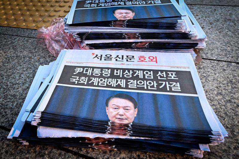 Extra edition newspapers are displayed at a subway gate in downtown Seoul - AFPpix