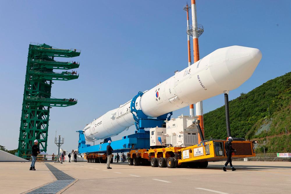 This handout photo taken on May 23, 2023 and provided by Korea Aerospace Research Institute (KARI) shows South Korea’s homegrown space rocket Nuri moving to its launch pad at the Naro Space Centre in the southern coastal village of Goheung, a day before its third attempt to put satellites into orbit. AFPPIX