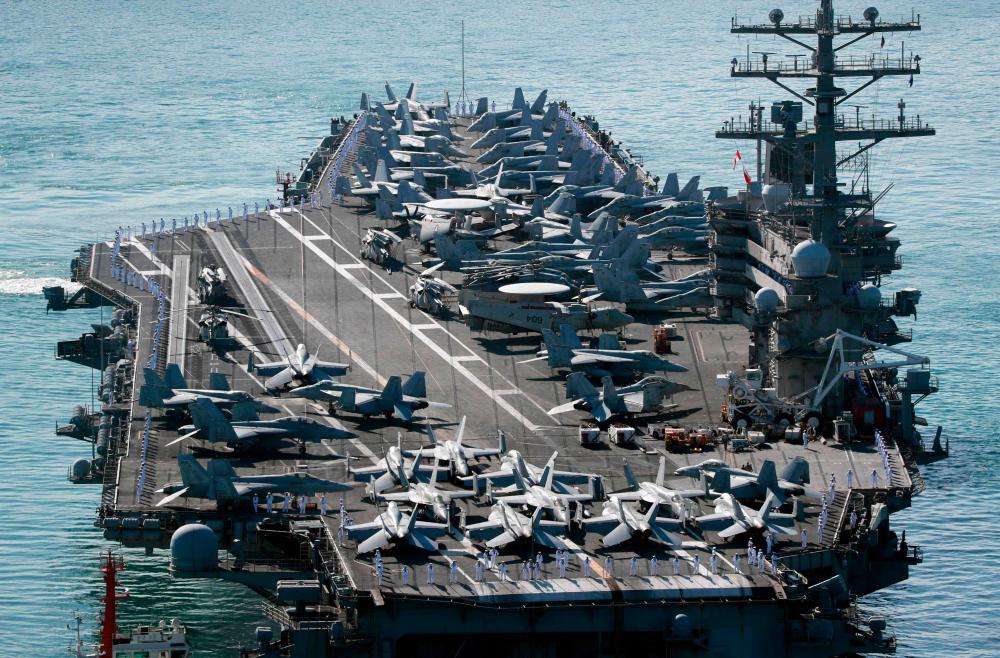 The US Navy’s nuclear-powered USS Ronald Reagan (CVN-76) aircraft carrier arrives at ROK Fleet Command in Busan, 390 kilometers south of Seoul, on September 23, 2022. AFPPIX