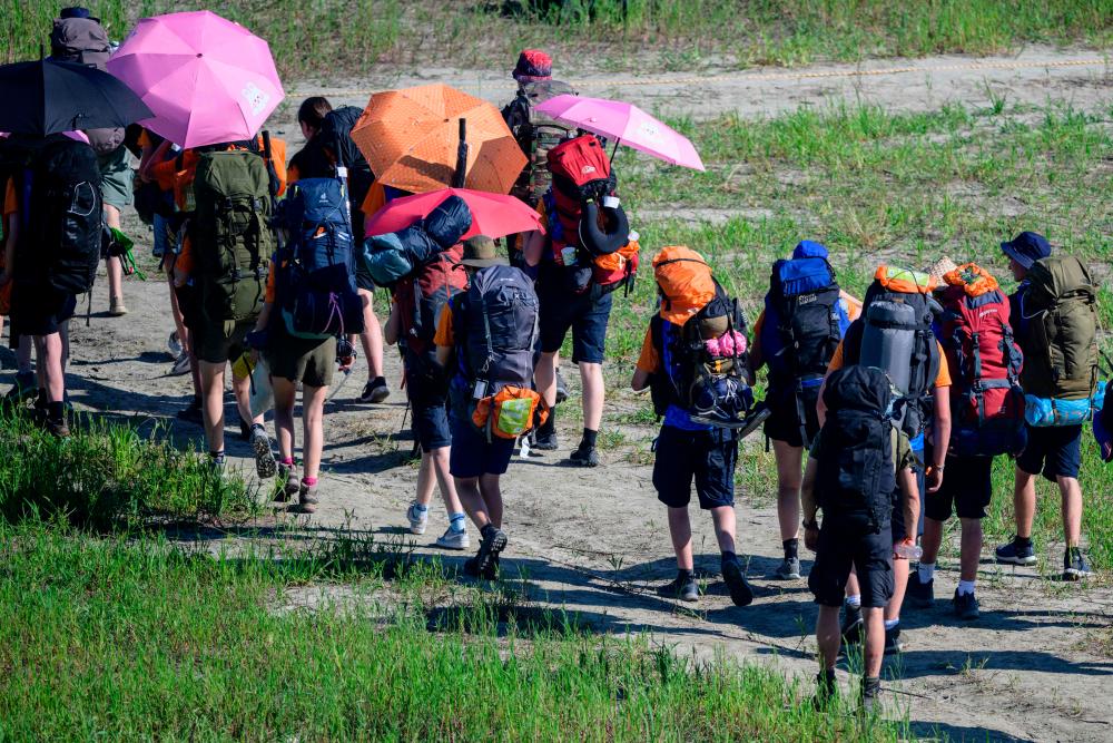 Scouts prepare to leave the World Scout Jamboree in Buan, North Jeolla province on August 8, 2023. - AFPPIX