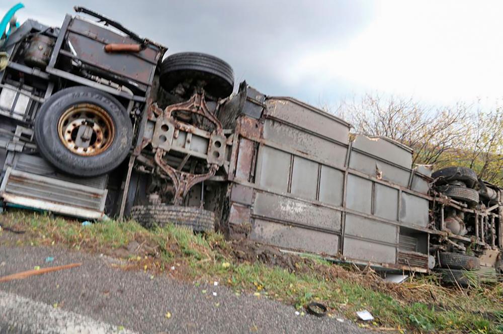 This handout picture made available by the Slovak Police on Nov 13, shows the bus at the scene of collision between a public bus and a truck near the village of Malanta on the outskirts of the city of Nitra, Slovakia. — AFP