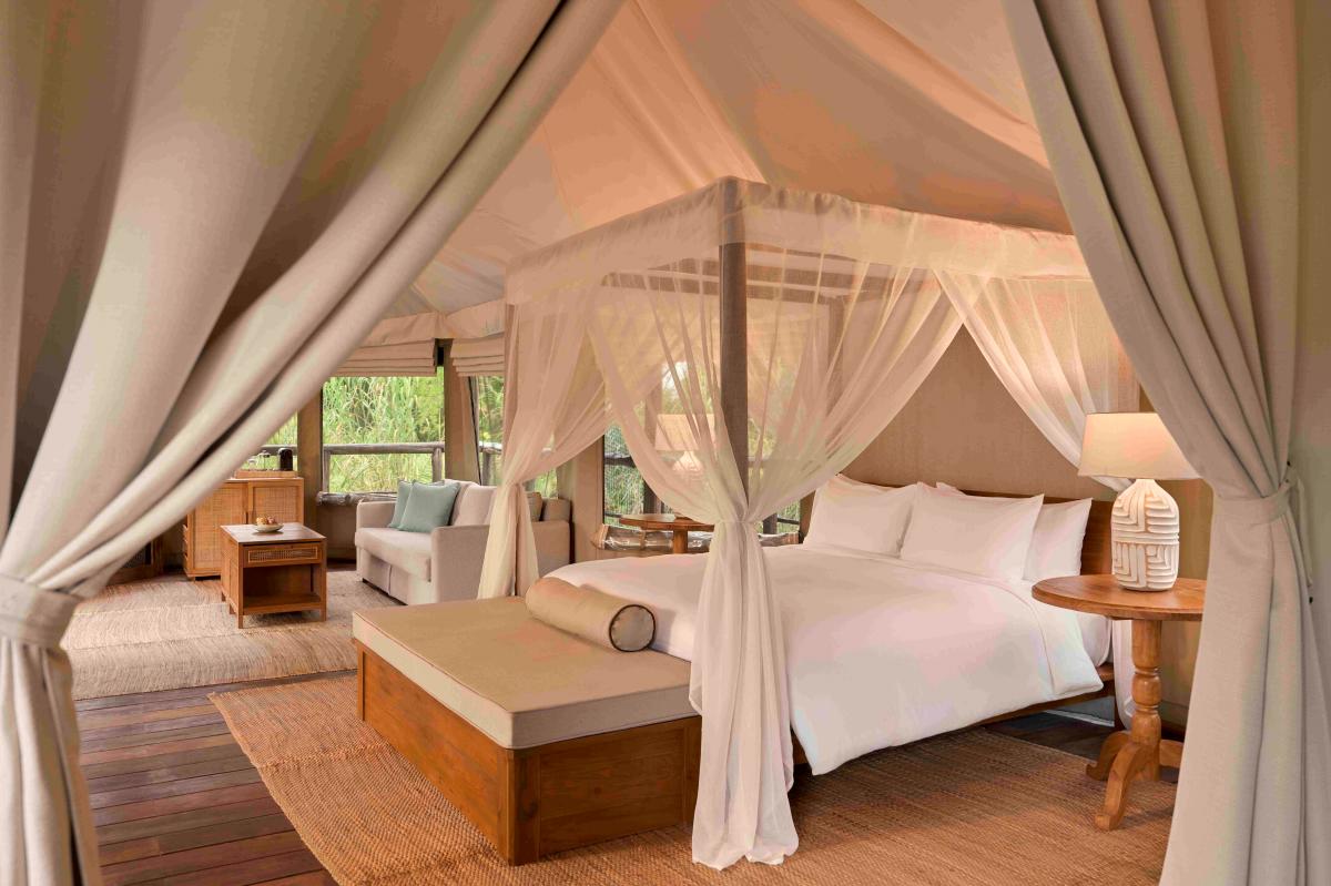 Tantawan Tented Camp features 10 spacious safari-style tents – from two-bedroom family options to a romantic one-bedroom suite – each with a private bathroom, handcrafted teak furnishings, and modern comforts designed in harmony with nature.