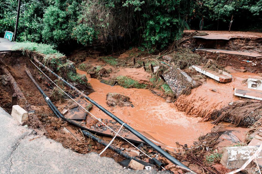 A general view of a severely damaged home and of the road infrastructure following heavy rains and winds in Umdloti north of Durban, on May 22, 2022. AFPpix