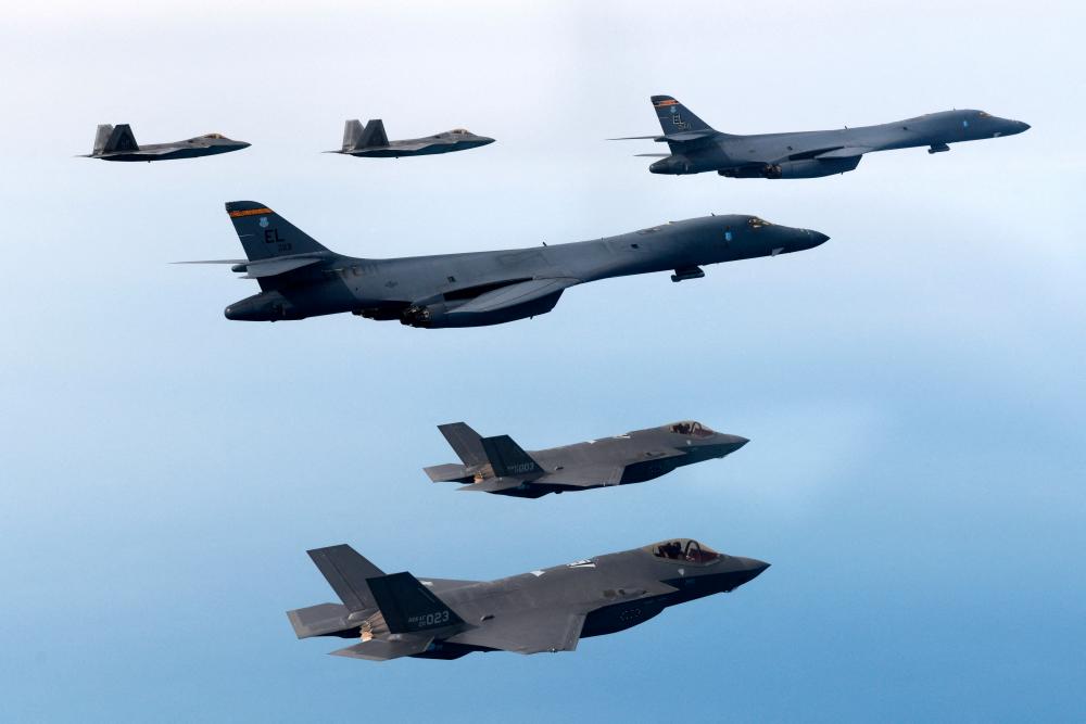A handout photo dated February 1, 2023 shows South Korean and U.S. Air Forces conducting a combined air training with South Korean F-35A fighters, US B-1B strategic bombers, and F-22 and F-35B fighters participating in the skies over the West Sea, in South Korea/REUTERSPix